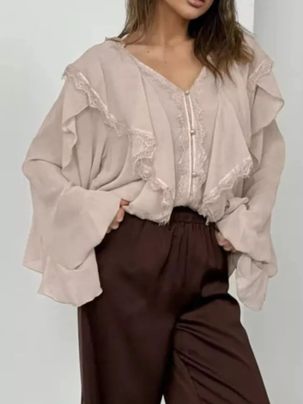 beige blouse with hip-length and half-button