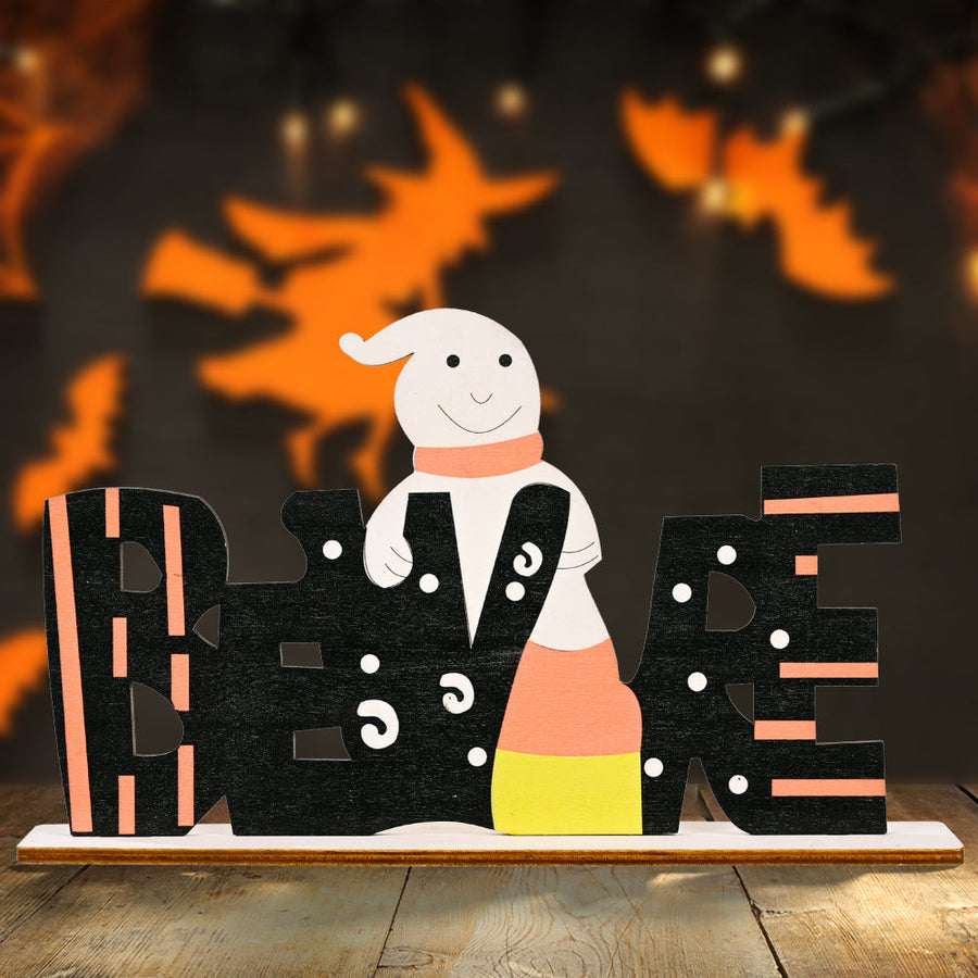 Halloween word block decor with a ghost and candy corn design.