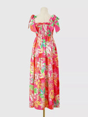 Tropical tie-strap smocked midi dress in strawberry with floral print and tiered skirt.