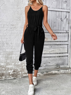 Black chain-strap gathered waist jumpsuit with tie belt and cuffed ankles