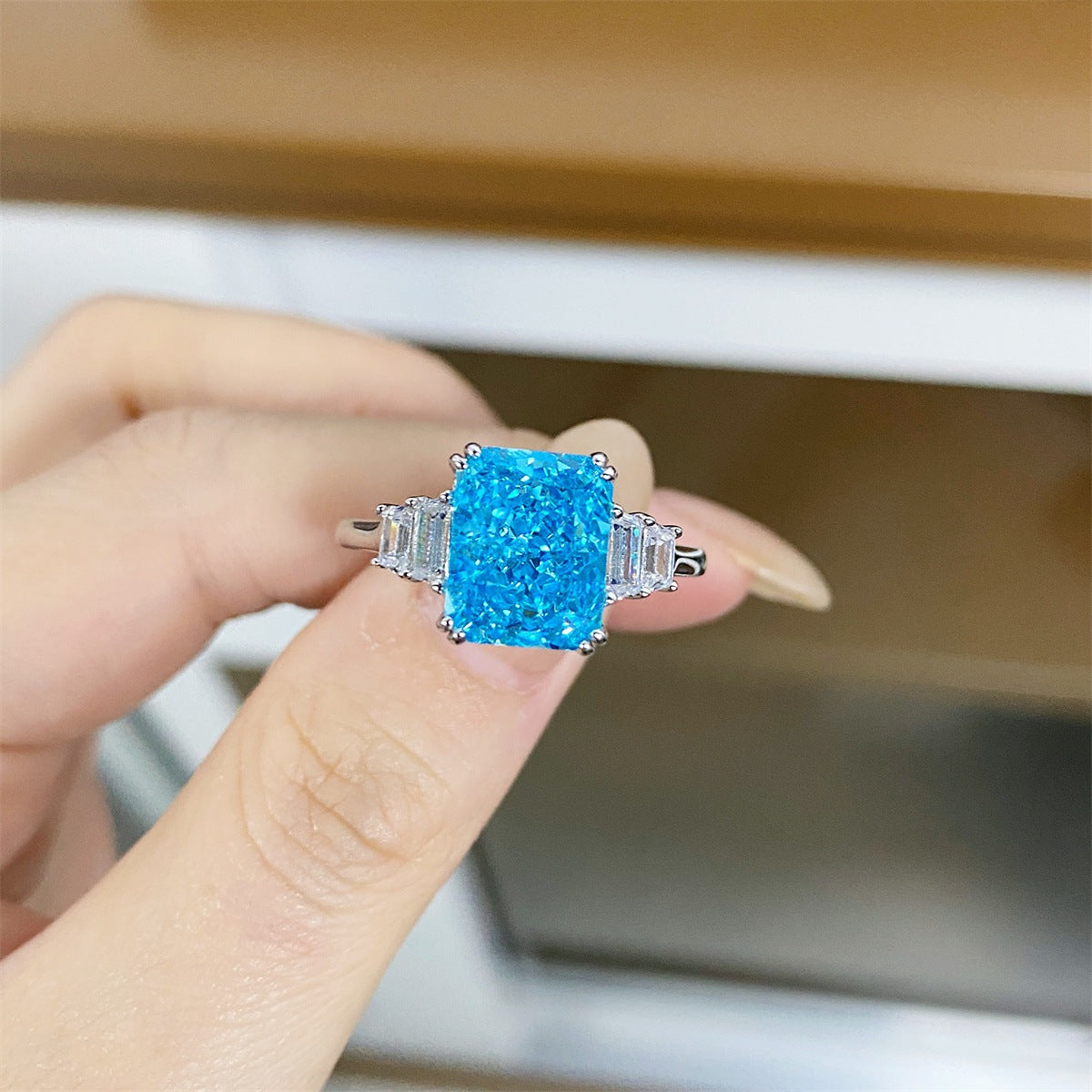 silver ring featuring zircon stones and geometric