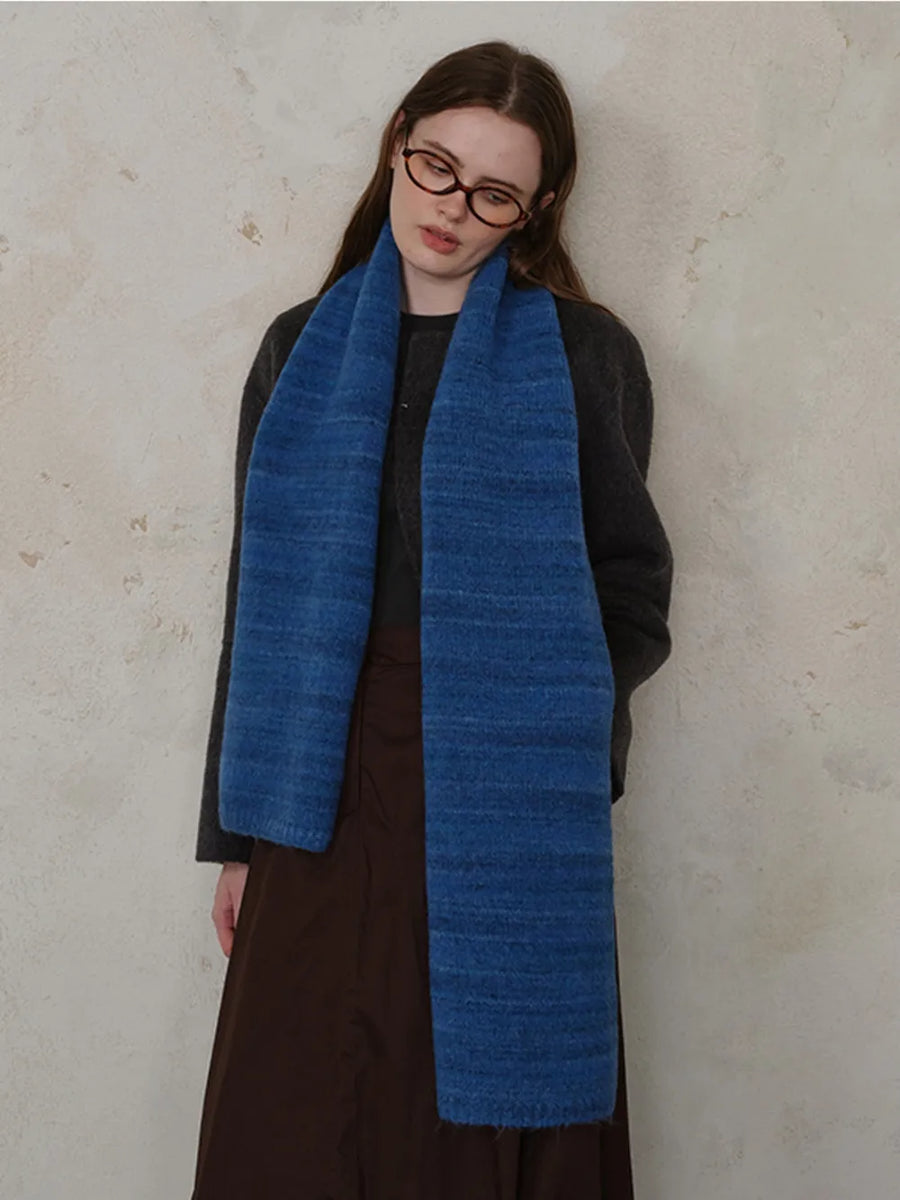 Textured mélange knit scarf in Royal Blue, styled casually.