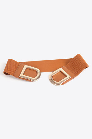Caramel elastic belt with double gold D-ring buckles and faux leather trim.