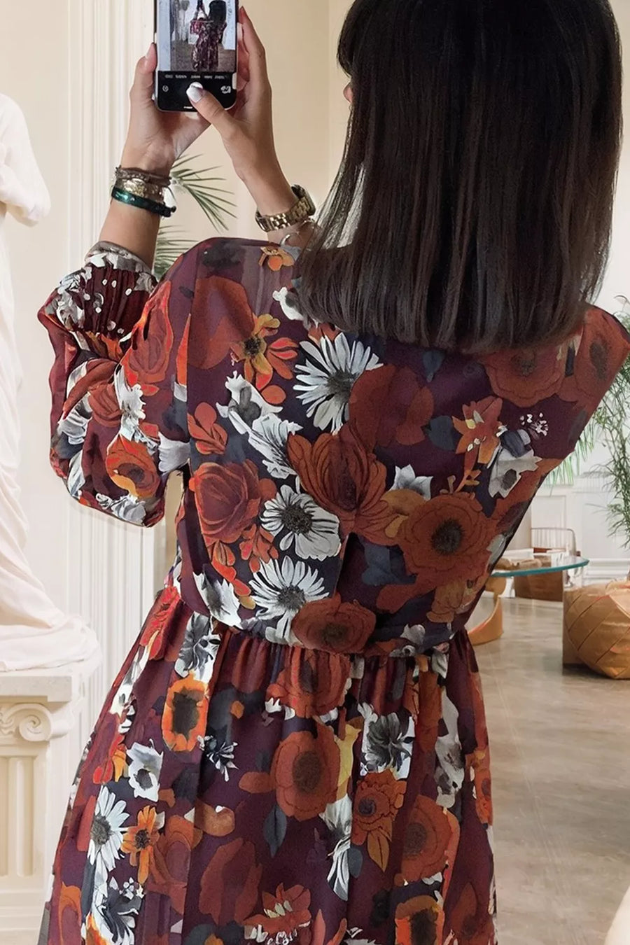Floral balloon sleeve mini dress with a gathered waist and billowy sleeves.