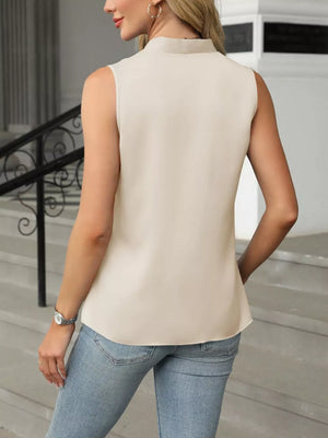 Apricot satin V-neck tank top with a high neckline and sleeveless cut.