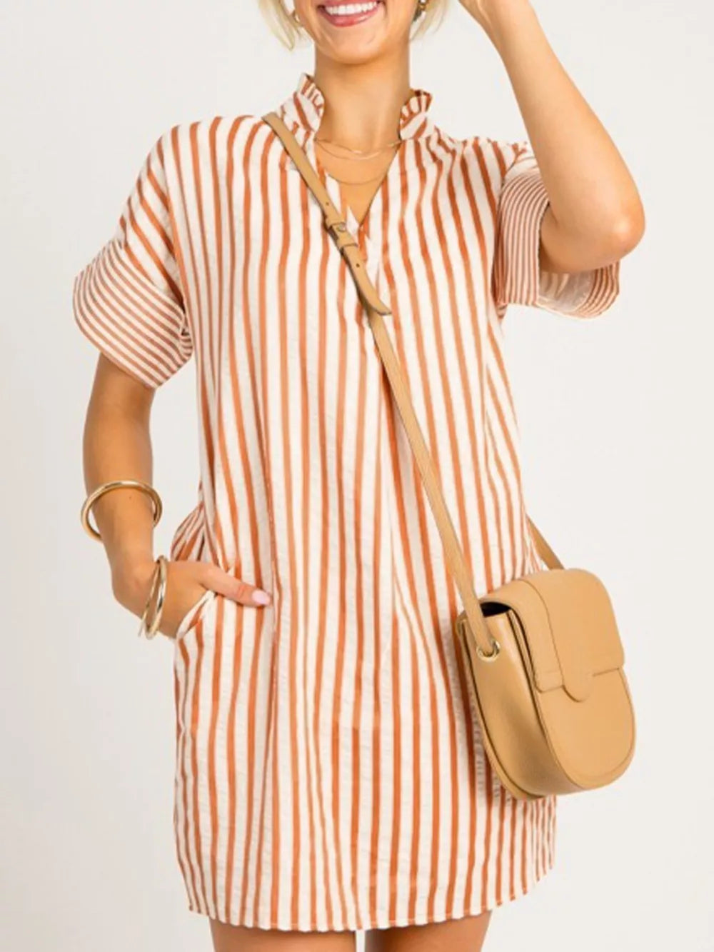 Striped V-neck shift mini dress with ruffled collar and short sleeves.
