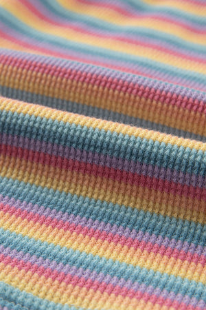 Rainbow stripe cotton loungewear set with textured fabric and soft pastel colors.