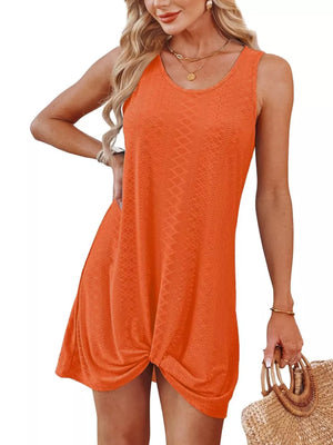 Orange eyelet tank dress with twisted hem detail and scoop neckline.