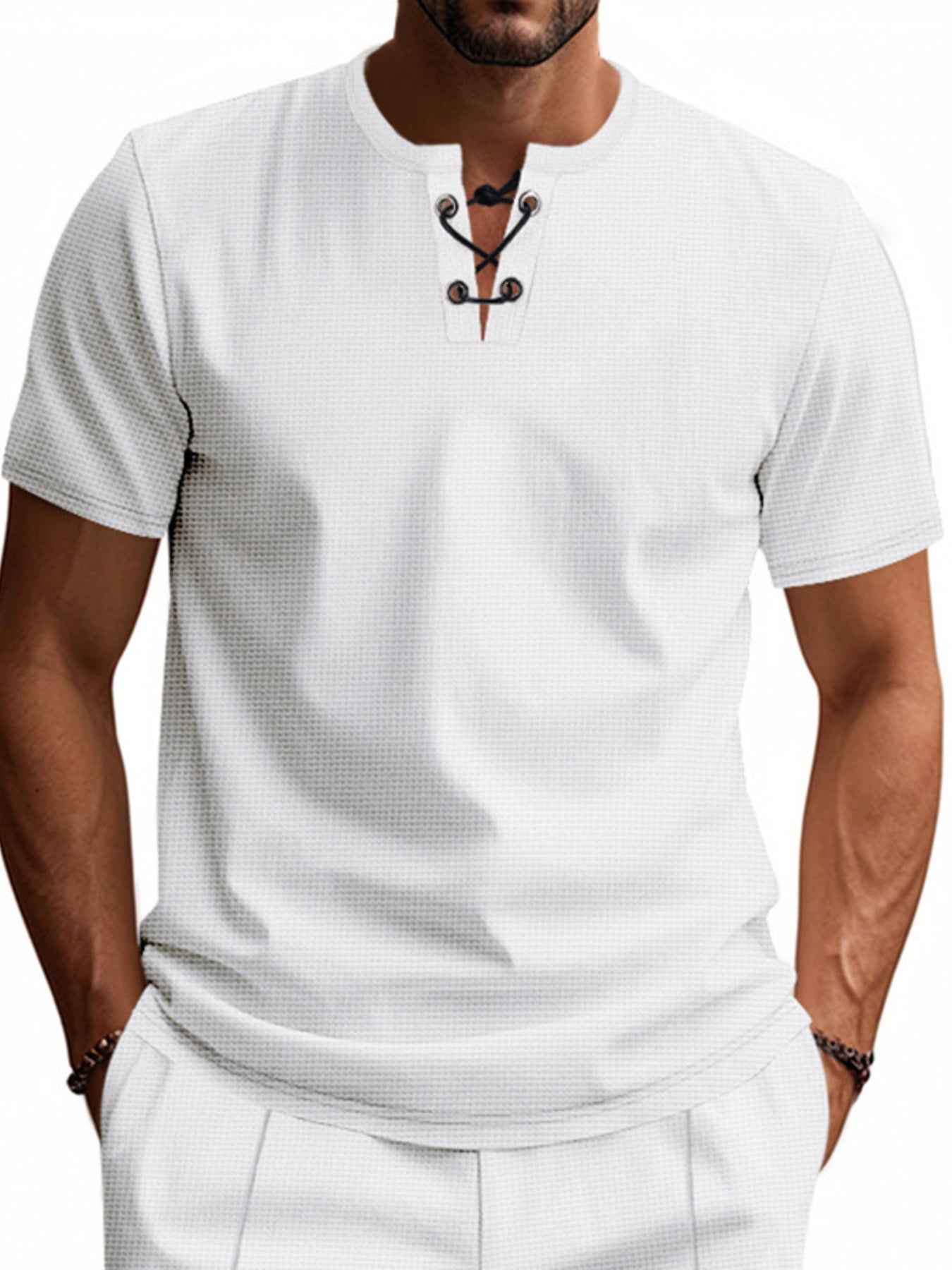 White cotton t-shirt with lace-up V-neck and short sleeves.