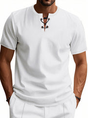 White cotton t-shirt with lace-up V-neck and short sleeves.