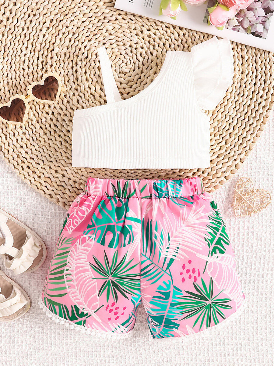 Baby girl's white asymmetrical top with ruffled sleeve and pink floral shorts.
