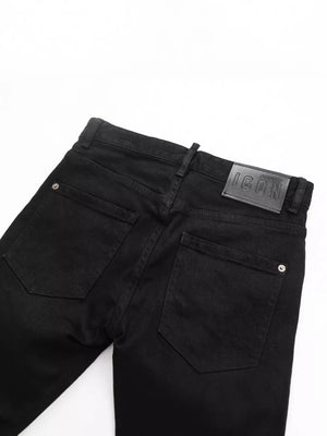 Black cotton slim fit jeans with back pocket detail and leather logo patch.