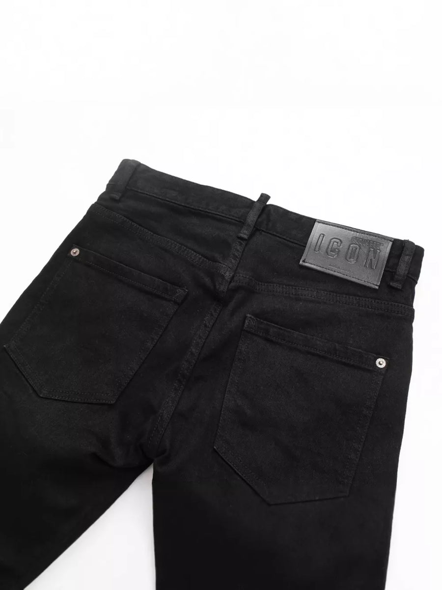 Black cotton slim fit jeans with back pocket detail and leather logo patch.
