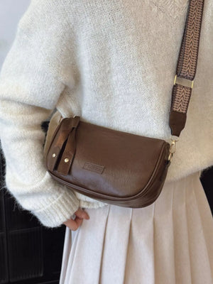 Retro shoulder crossbody bag in coffee brown with patterned strap and embossed detail.