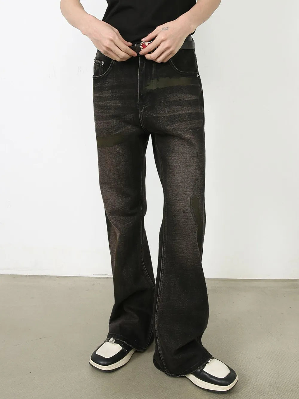 Faded flare jeans in dark distressed wash denim with subtle distressing and a flared leg