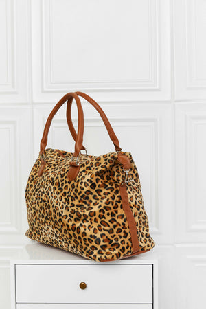 Leopard print travel satchel with brown leatherette handles and trim