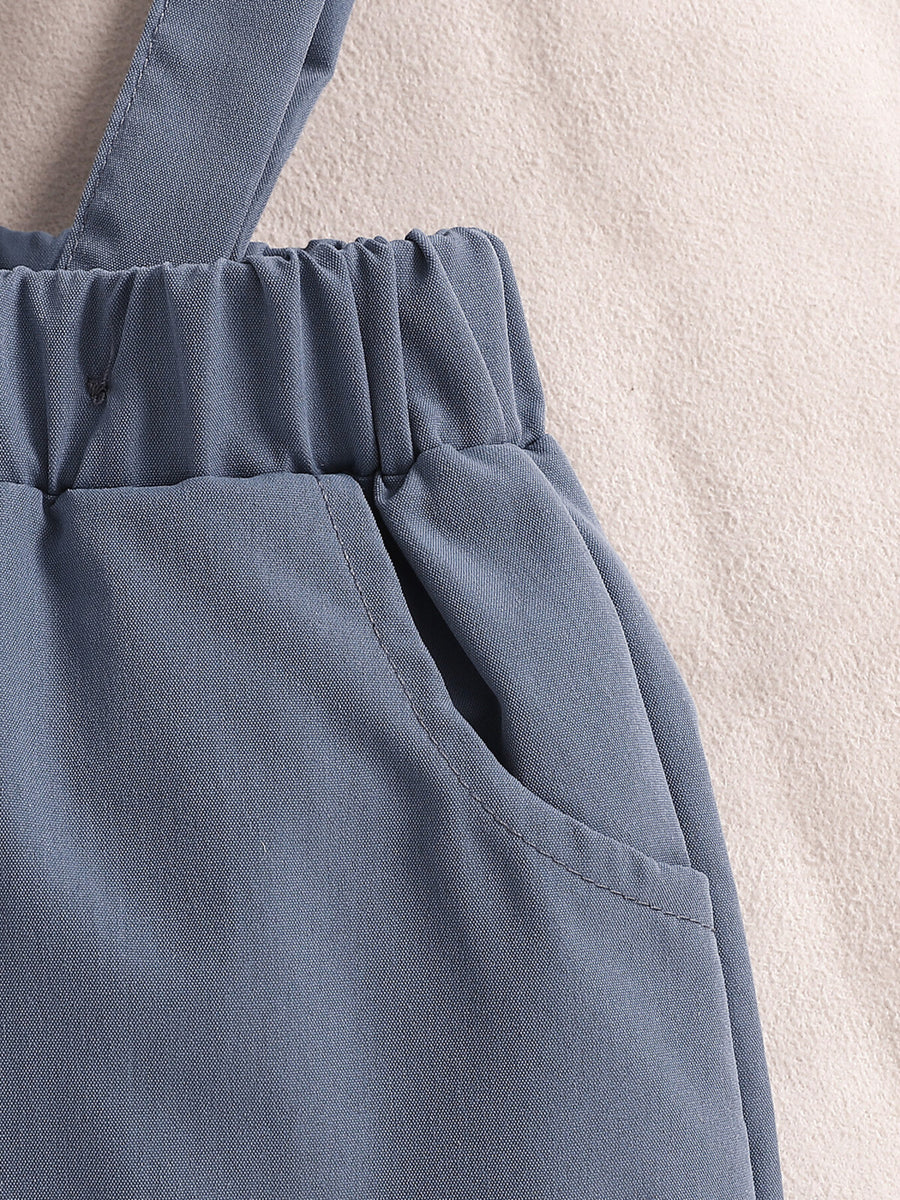 Sky blue baby suspender shorts with elastic waistband and pocket detail.