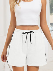Heathered jogger shorts in gray/white with black drawstring and sporty trim.
