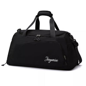 Black medium waterproof duffel bag with multiple pockets and adjustable strap.