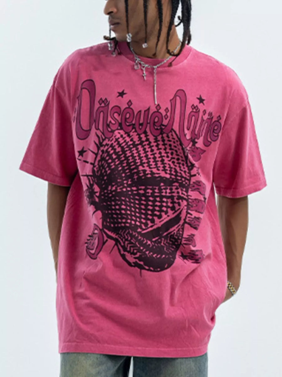 Pink oversized half sleeve cotton tee with graphic print and text.