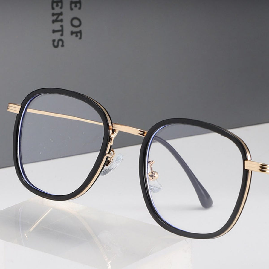 Black and gold lightweight metal-temple eyeglasses with clear lenses.