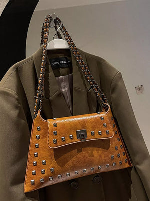 Brown embellished chain flap shoulder bag with silver studs and a metal clasp.