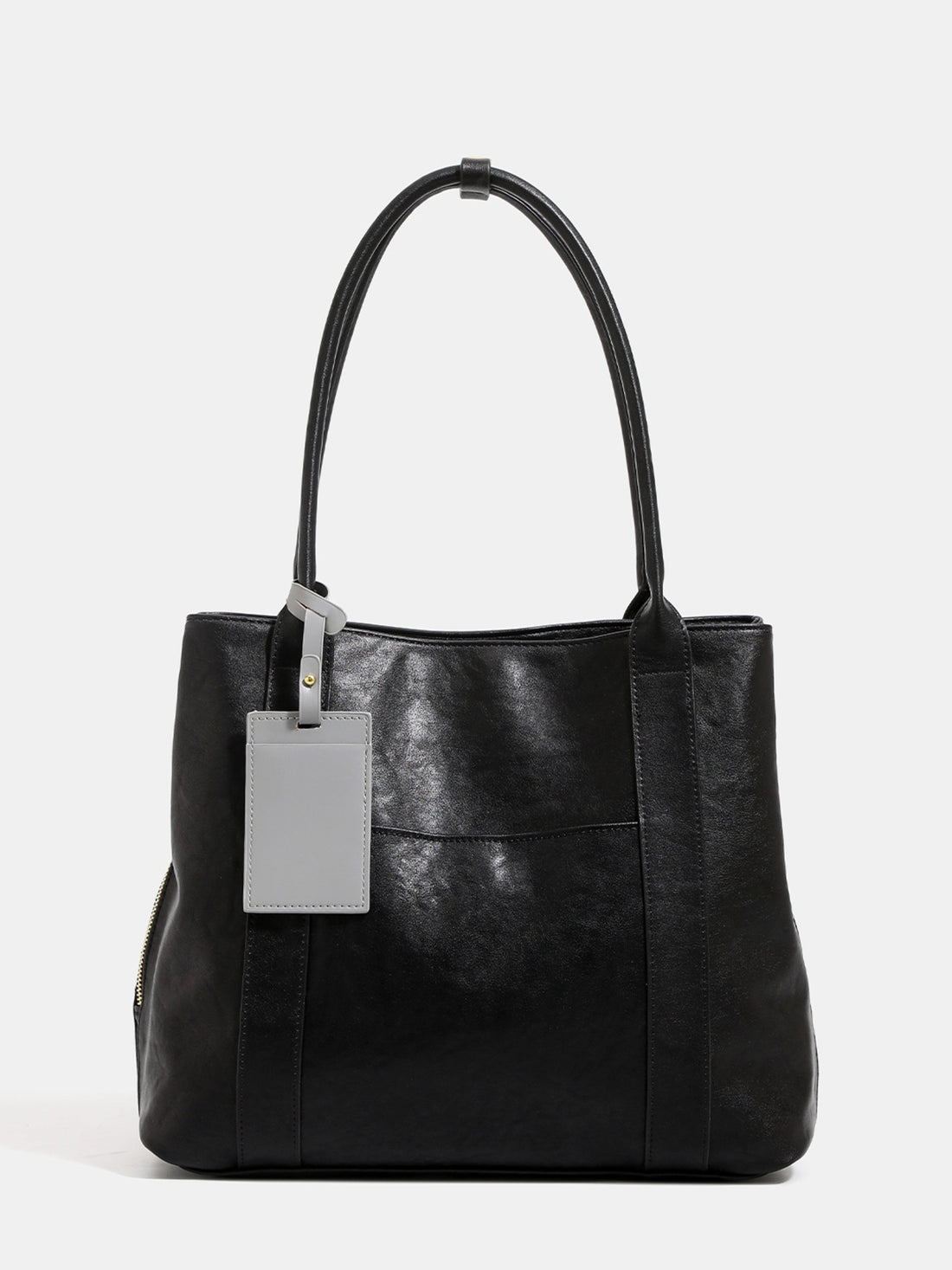 tote in black featuring shoulder straps and boxy fit