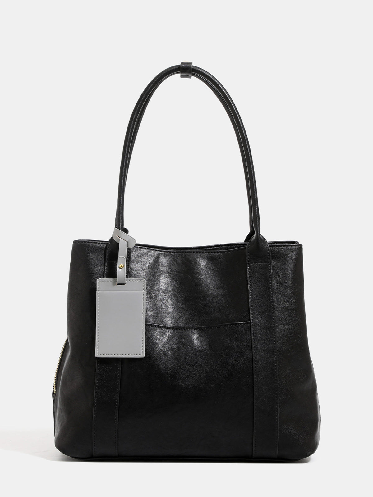 tote in black featuring shoulder straps and boxy fit