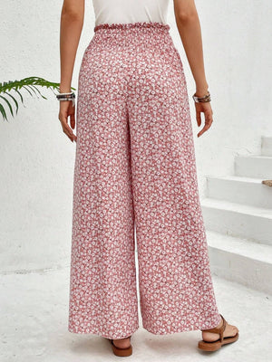 Blush pink floral print palazzo pants with a smocked waist and wide leg
