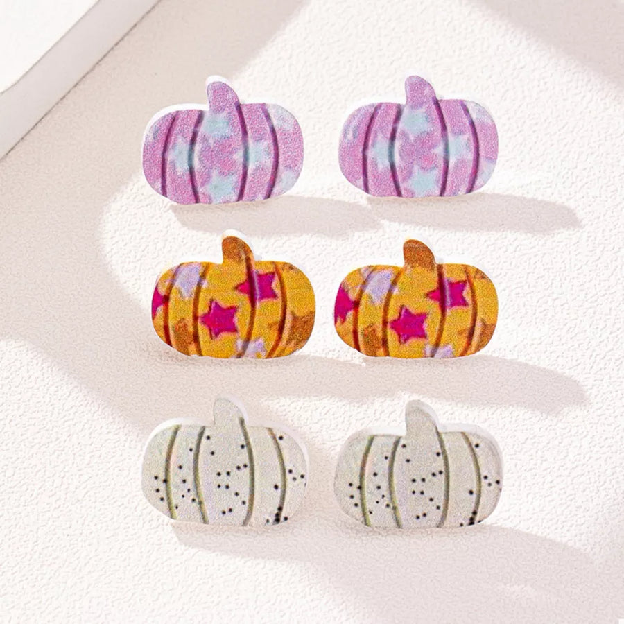 yellow earrings featuring pumpkin shape and striped