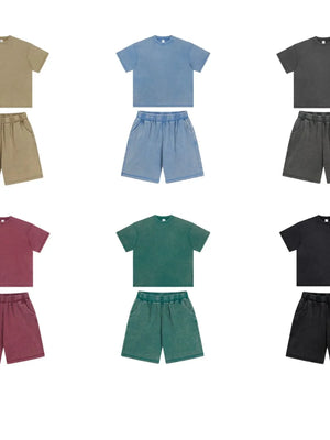 Urban Ease Half Sleeve Tee in Dusty Blue, Deep Teal, and Black with matching shorts.