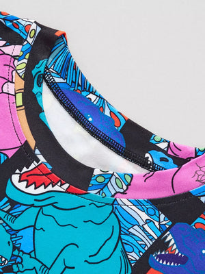 Crew neck t-shirt with a colorful cartoon dinosaur print and black trim.
