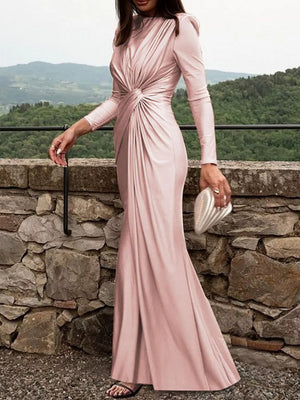 Pink ruched long sleeve maxi dress with boat neckline and bodycon fit.