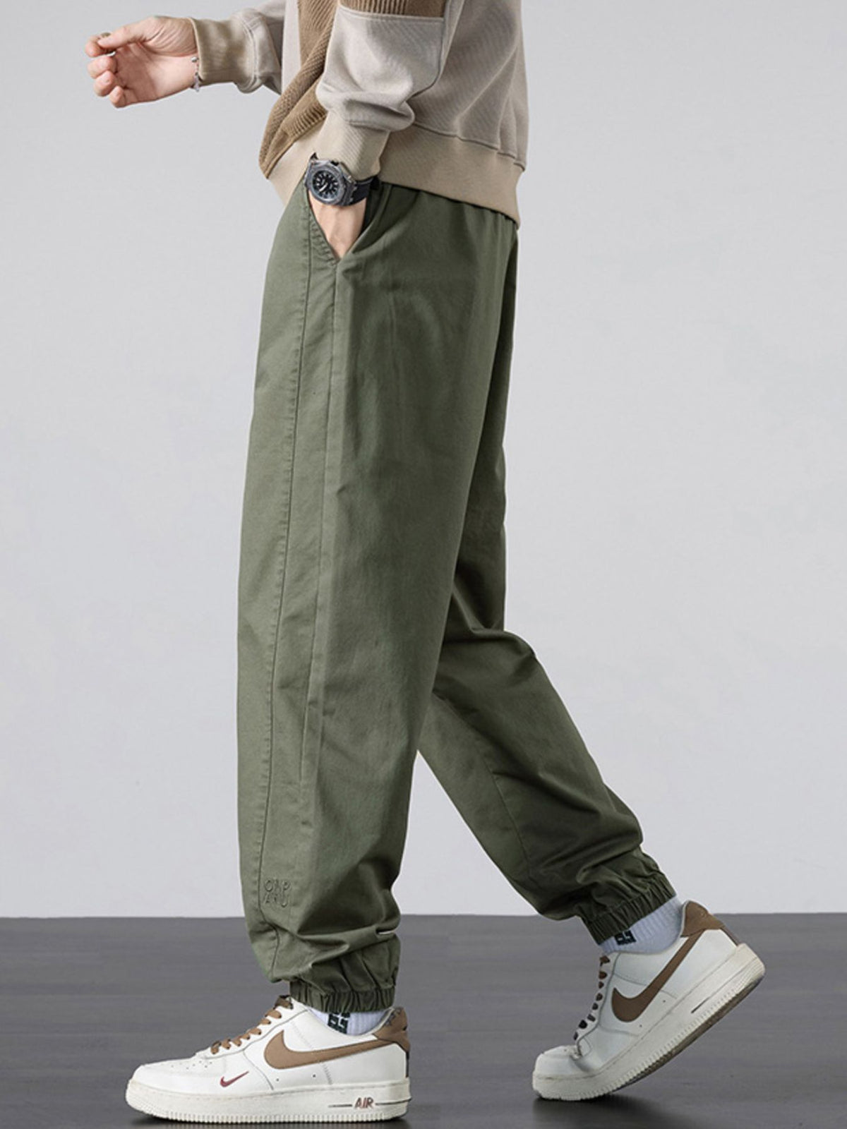 95%polyester,5%spandex Care instructions: Machine wash cold joggers in Black with loose silhouette
