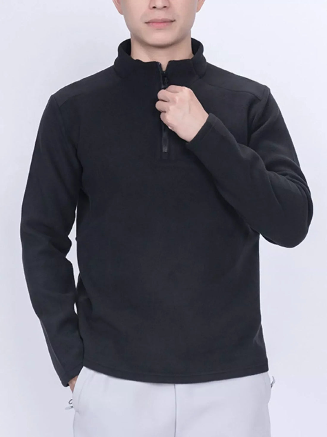 Black fleece quarter-zip sweatshirt with a stand-up collar.