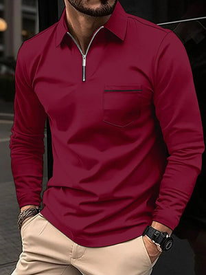 Burgundy zip-front polo shirt with contrast pocket detail and long sleeves.