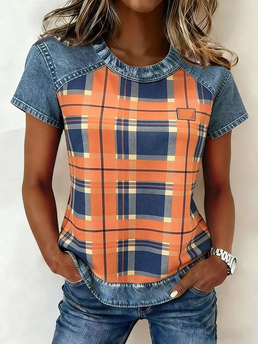 Denim patchwork shirt with orange and blue plaid print, short sleeves, and crew neck.
