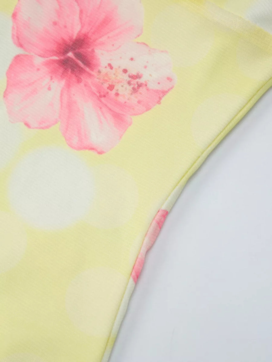 Yellow floral asymmetrical mini dress with ruffled hem detail