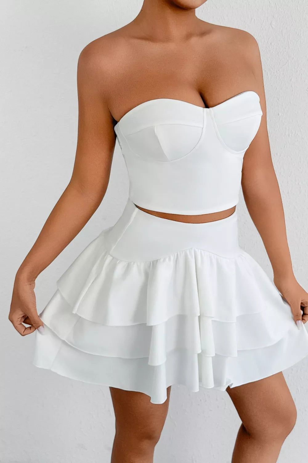 White strapless corset top and tiered ruffle mini skirt set