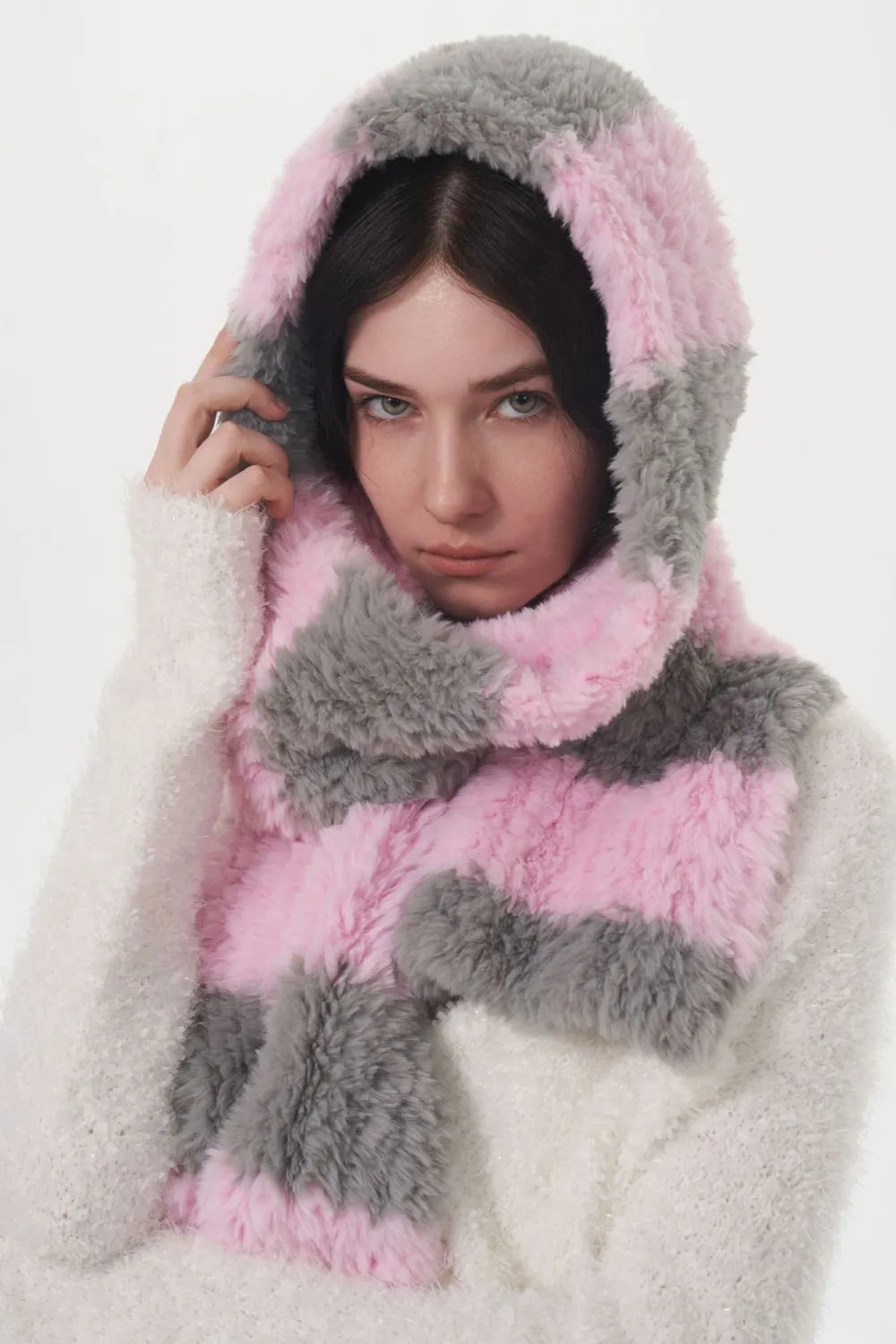 Plush hooded scarf with pink and grey stripes and fuzzy white trim.