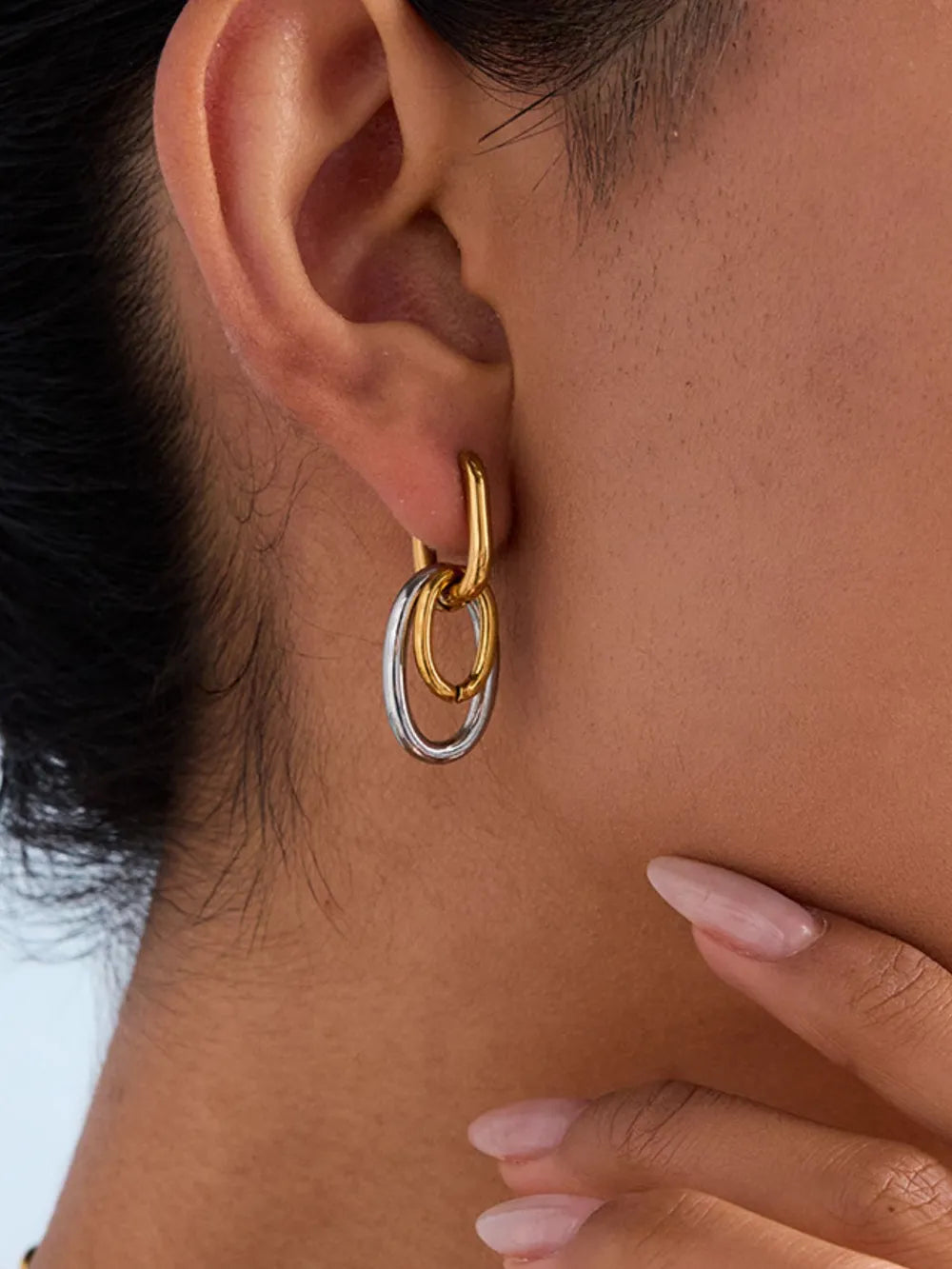 earrings in gold featuring two-tone and hoop fit