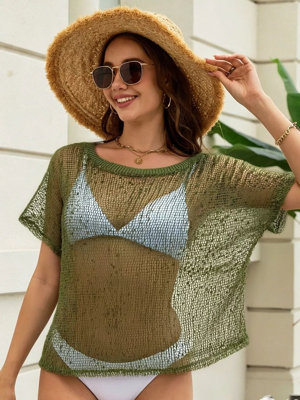 Army green crochet knit swim cover-up with openwork texture and short sleeves.