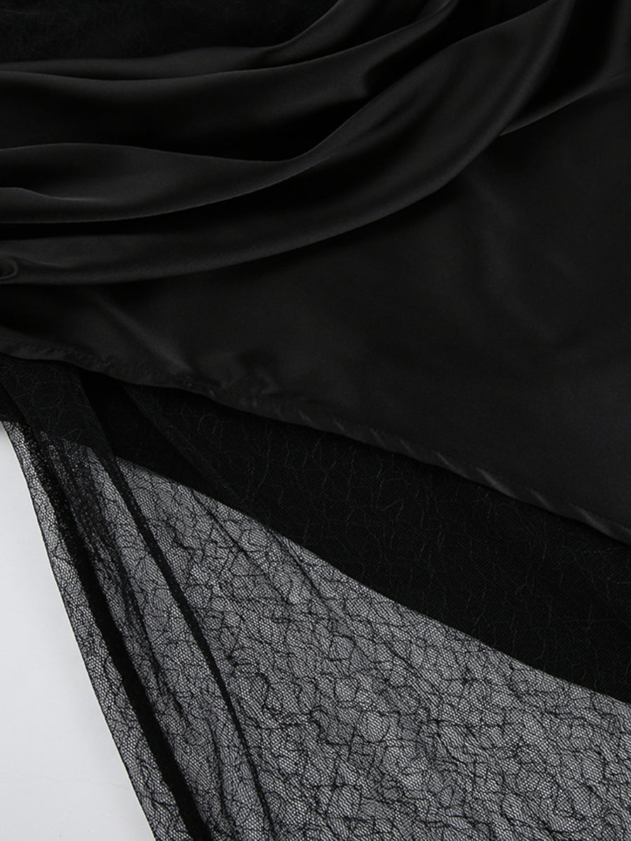 Black midi skirt with sheer lace panel detail and draped satin overlay.