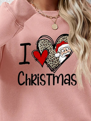 Blush pink crewneck sweatshirt with festive heart graphic and Santa detail.