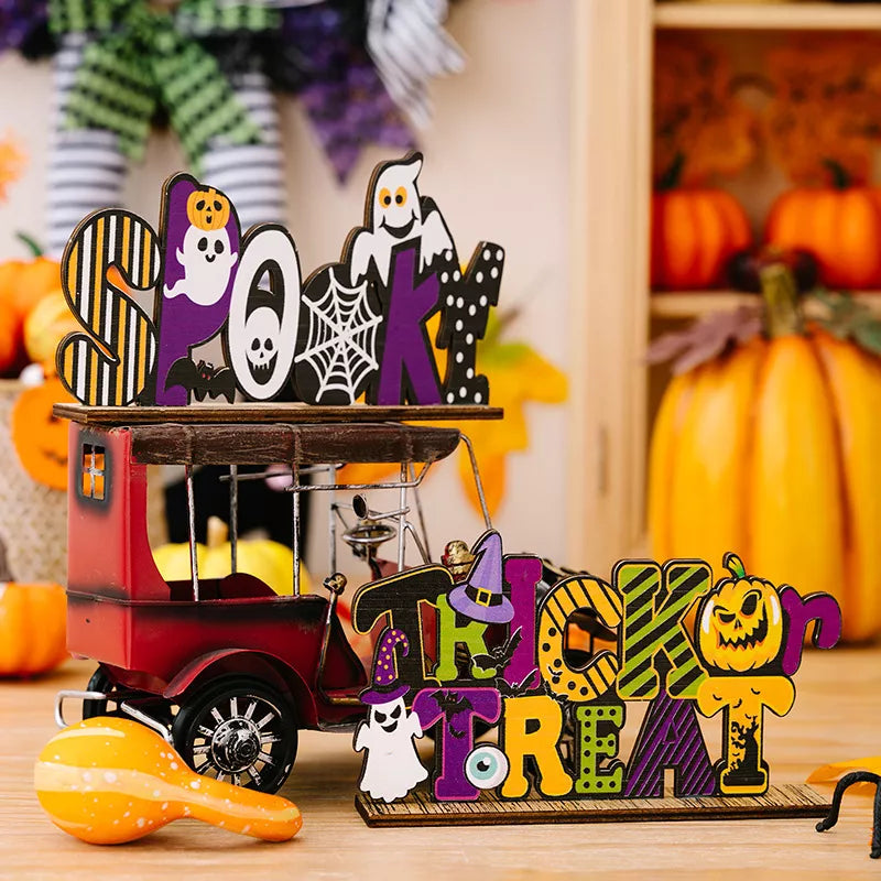 black decorative ornament featuring Halloween motifs and striped