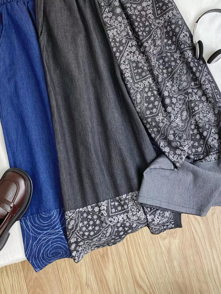 Printed comfort jeans in blue and black with paisley and swirl patterns.