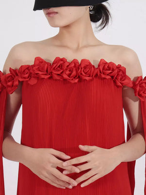Red off-shoulder maxi dress with floral appliques and pleated fabric