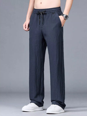 Navy blue casual lightweight trousers with drawstring waist and pockets.