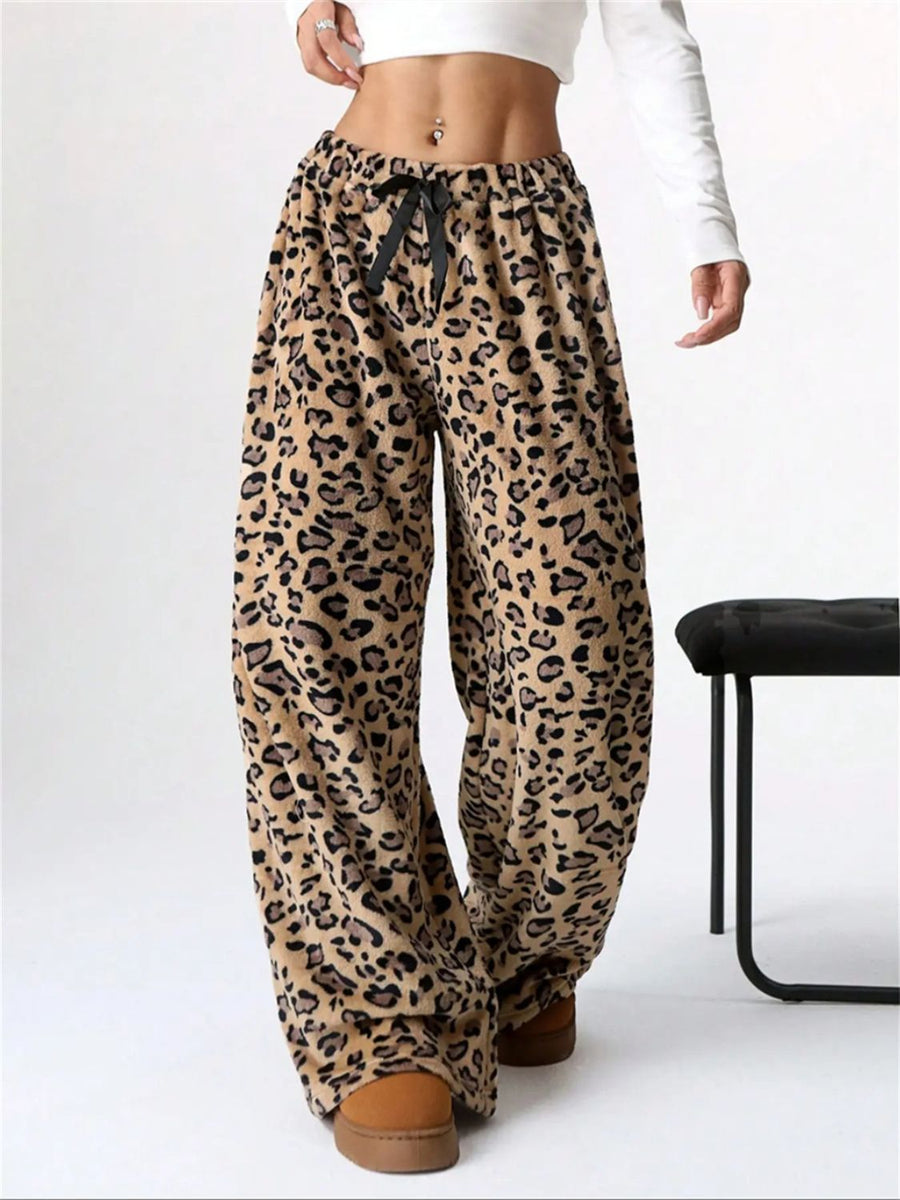 Leopard print lounge palazzo trousers with black bow detail and wide leg.