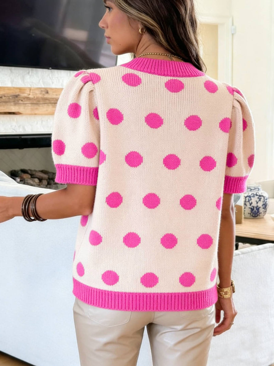 Cream knit top with hot pink polka dots, puff sleeves, and contrast trim.
